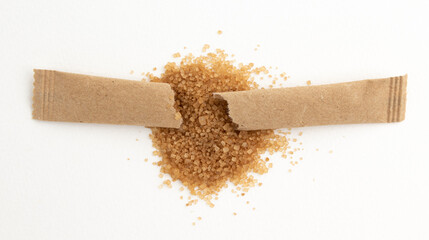 cane sugar isolated on white backgroundpaper sticks of cane sugar, sugar in paper kraft packaging, mock up for design isolated on white background with clipping path, top view