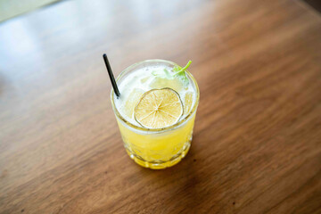 cocktail on top of wooden table at fine dining argentinian steakhouse in miami