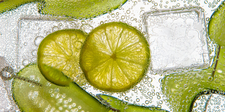  Wide Closeup of bubbles, lime, tonic water, cucumber