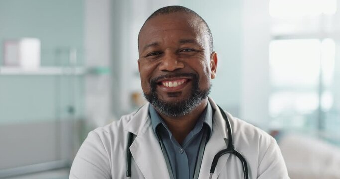 Healthcare, doctor and face of black man at hospital with smile for support, service and wellness. Medicine, professional and African expert with happiness and pride for career, surgery or insurance
