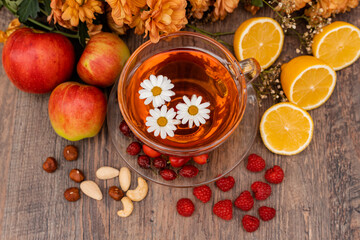 Vitamin tea made from lemons and rose hips. Herbal tea in a clear cup