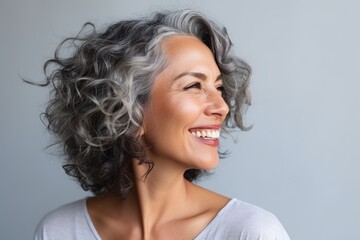 Smiling happy Beautiful mature woman looking away - Powered by Adobe