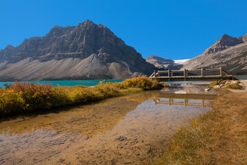 Stunning scenery at Bow Lake with reflections and fall colors along the Icefields Parkway in Banff...