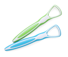 Tongue cleaners isolated on white, top view. Dental care