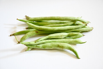 bunch of green beans on isolated white background. Buncis or Phaseolus vulgaris  or Phaseolus esculentus.