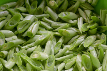 Close up of green beans slice on isolated white background. Buncis or Phaseolus vulgaris  or Phaseolus esculentus.