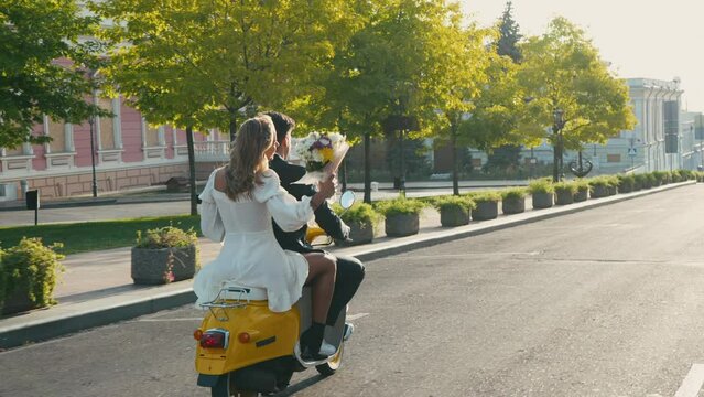 Husband and wife share moment of joy riding motorcycle