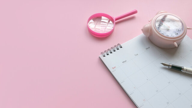 Concept of plan a monthly calendar for meetings or manage your daily activities.Pink banner. Copy space.	
