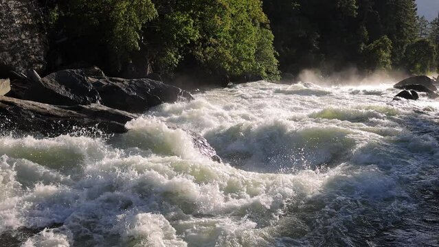 River Rapids in the Merced River as it runs through Yosemite National Park in California. Slow Motion.