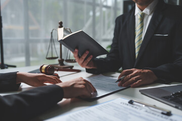 Consulting of business woman and male lawyer or legal consultant having team meeting with client,...