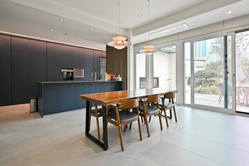 Interior design with a wooden dining table in the middle of the living room is a trend these days
