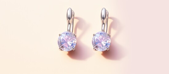 Silver sapphire earrings on a isolated pastel background Copy space with hinged lock