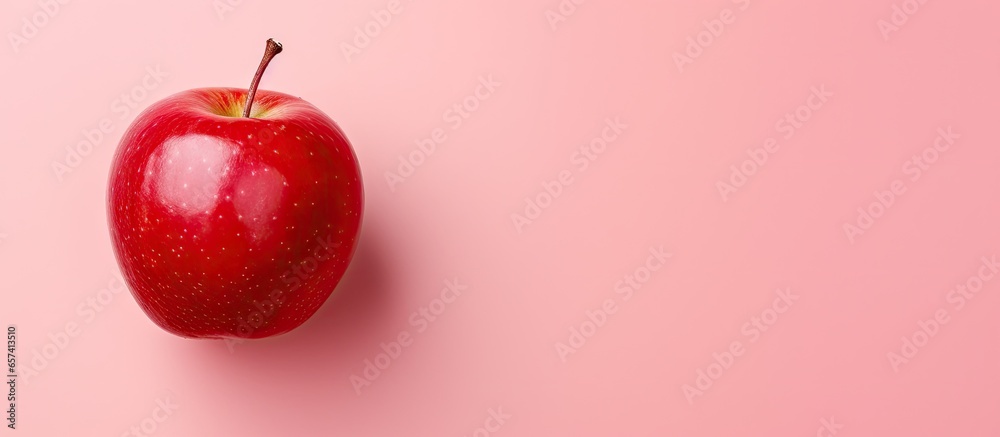 Poster red apple on a isolated pastel background copy space