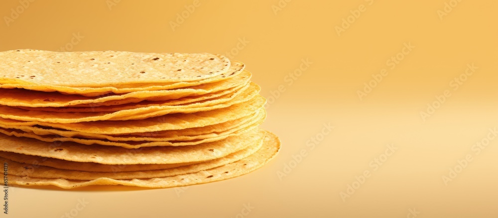 Poster stack of corn tortillas on isolated pastel background copy space