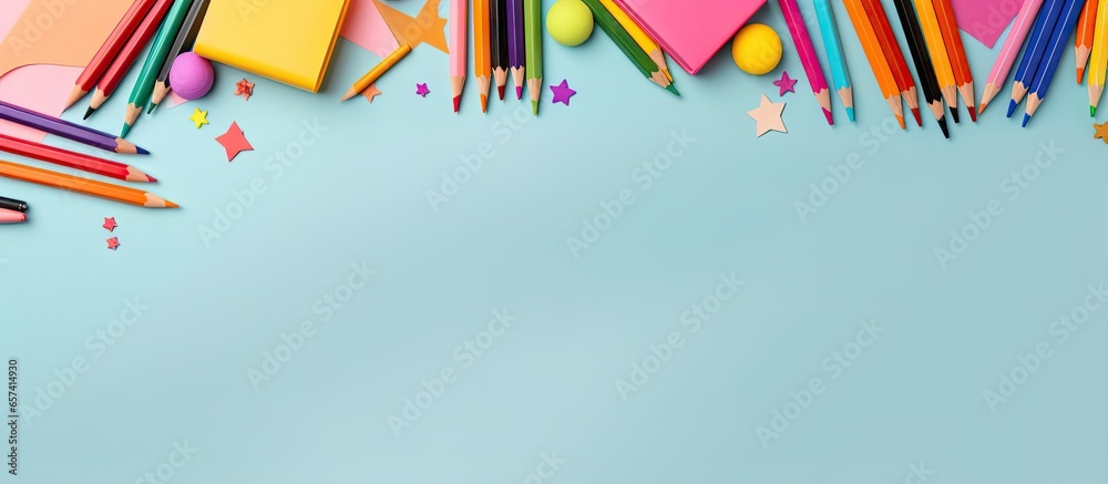Poster top view of flat lay with school supplies in a frame isolated pastel background copy space