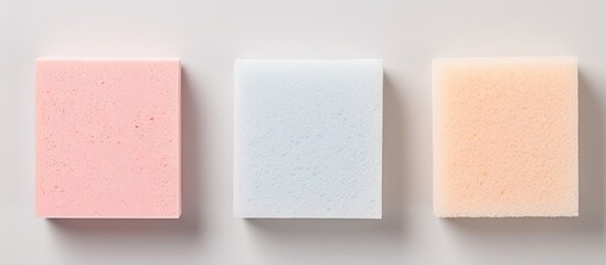 Three sponges in kitchen isolated isolated pastel background Copy space - obrazy, fototapety, plakaty