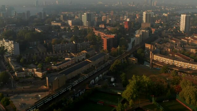C2C train passing through Limehouse East London Neighbourhood golden hour