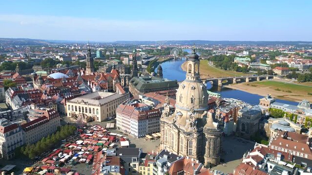 Neumarkt Great aerial top view flight 
Dresden city Women church Frauenkirche City town Germany, summer sunny blue sky day 23. tilt down drone
4k cinematic footage