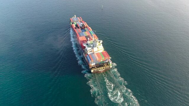 Aerial view container ship carrying containers in import export business logistics and international transportation using ships