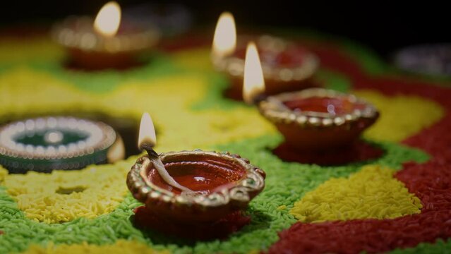 Clay diya lamps lit during diwali celebration, Diwali, or Deepavali, is India's biggest and most important holiday.