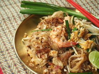 Pad Thai - Stir fried rice noodles with eggs, dried shrimp, tofu, tamarind paste, chinese chives and bean sprout