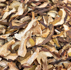 Dried porcini mushrooms as a background. Close-up