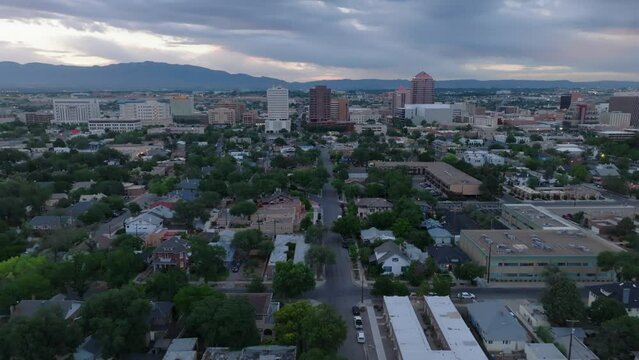 Albuquerque, New Mexico skyline at dawn. Aerial descending shot of city in Southwest USA during morning.