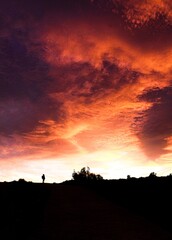 Hiker enjoying orange sunset in the mountain © Noelia