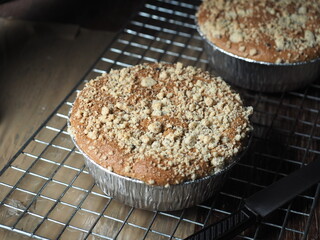round crumble cake in aluminum foil