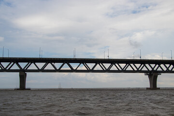 Fototapeta premium Most extensive Padma bridge photography under the dark cloudy sky