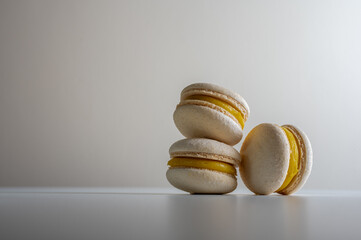 chocolate and lemon macaroons on a light background close-up. Sweets. Place for inscription