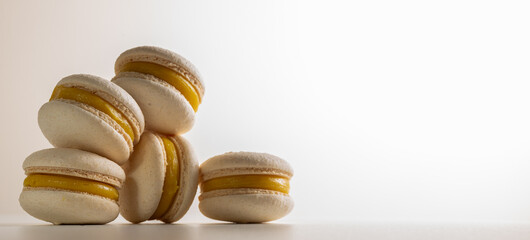 chocolate and lemon macaroons on a light background close-up. Sweets. Place for inscription