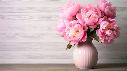Vase with pink peonies flowers