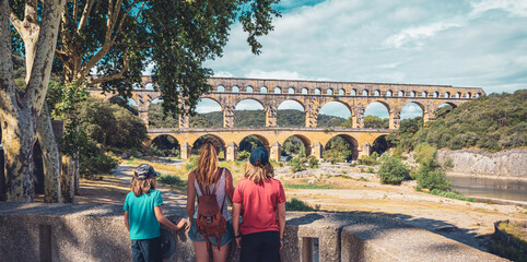 Family visiting the Pont du Gard in France