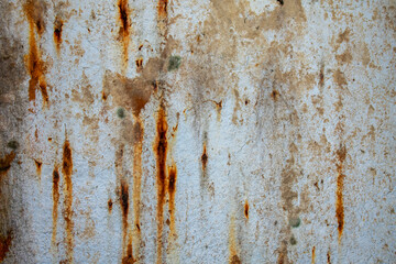 Rust of metals.Corrosive Rust on old iron with a hole. Rusted orange painted metal wall.