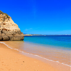 idyllic sandy beach, clear blue sea or ocean- travel,vacation,relax