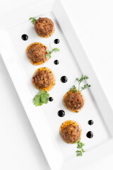 thai fish cake balls in gourmet contemporary restaurant on white background - 657464320