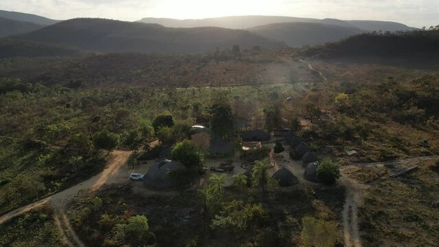 aerial view village in Chapada dos Veadeiros "Aldeia Macaco" hollow-shaped bioconstruction houses cerrado beauty landscape Goi&aacute;s Brazil