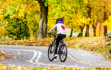 Fototapeta premium Cyclist ride on the bike path in the city Park