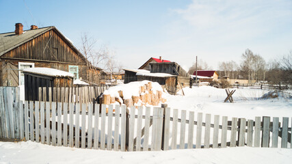 A village in the Russian outback. Old leaning houses in the Far East of Russia. The once thriving...