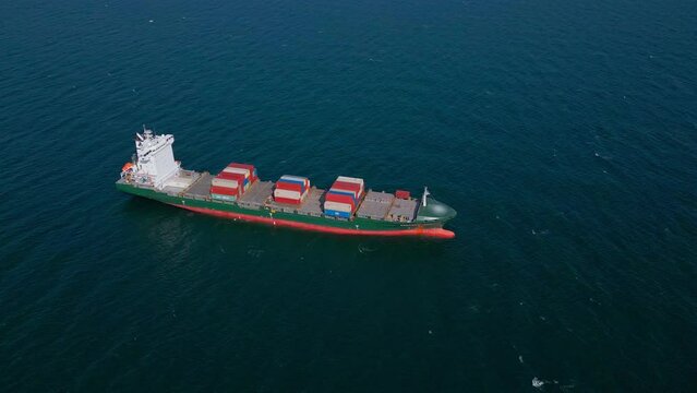 A container ship in the sea, aerial top view