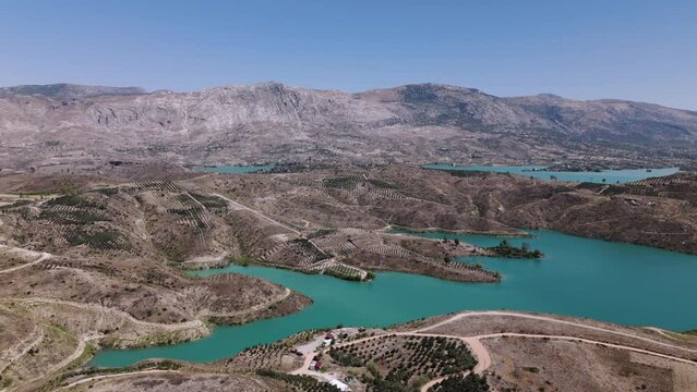 Establishing aerial view across the picturesque turquoise water of Green lake in the Taurus mountains of Turkey