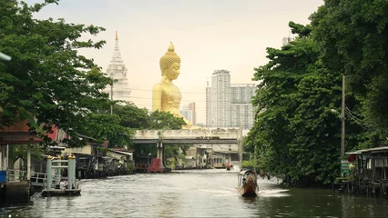Fotobehang Boeddha The giant buddha statue at the Wat Paknam Phasi Charoen temple in Bangkok, Thailand. Famous buddhist and the peaceful beauty in Bangkok, Thailand  © M Stocker