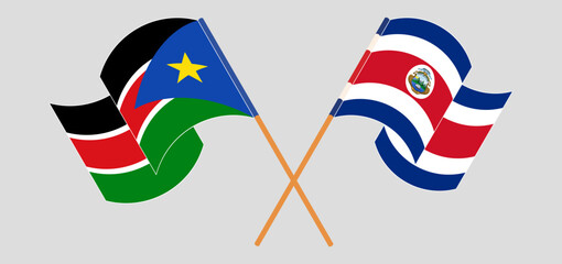 Crossed and waving flags of South Sudan and Costa Rica