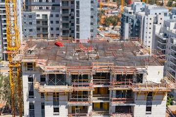 Time lapse of the process of constructing a multi-storey building, pouring concrete, laying reinforcement for concrete, installing formwork. High quality photo