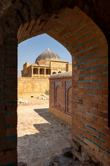 Beautiful mughal era carved sandstone tomb of Isa Khan Tarkhan II in UNESCO listed Makli necropolis, Thatta, Sindh, Pakistan