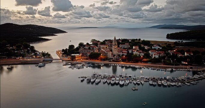 Stunning cinematic hyperlapse of Osor Croatia coastal village at dusk by the dock