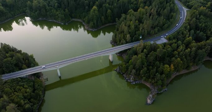 Highway bridge crosses over portion of Stausee Ottenstein reservoir, Austria. Drone overview