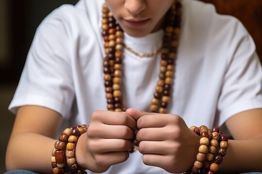 young man counting using worry beads