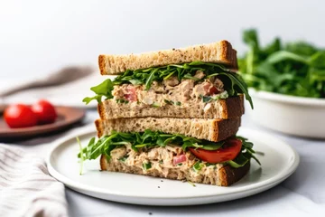 Zelfklevend Fotobehang tuna salad sandwich on a square white plate with silverware © Natalia